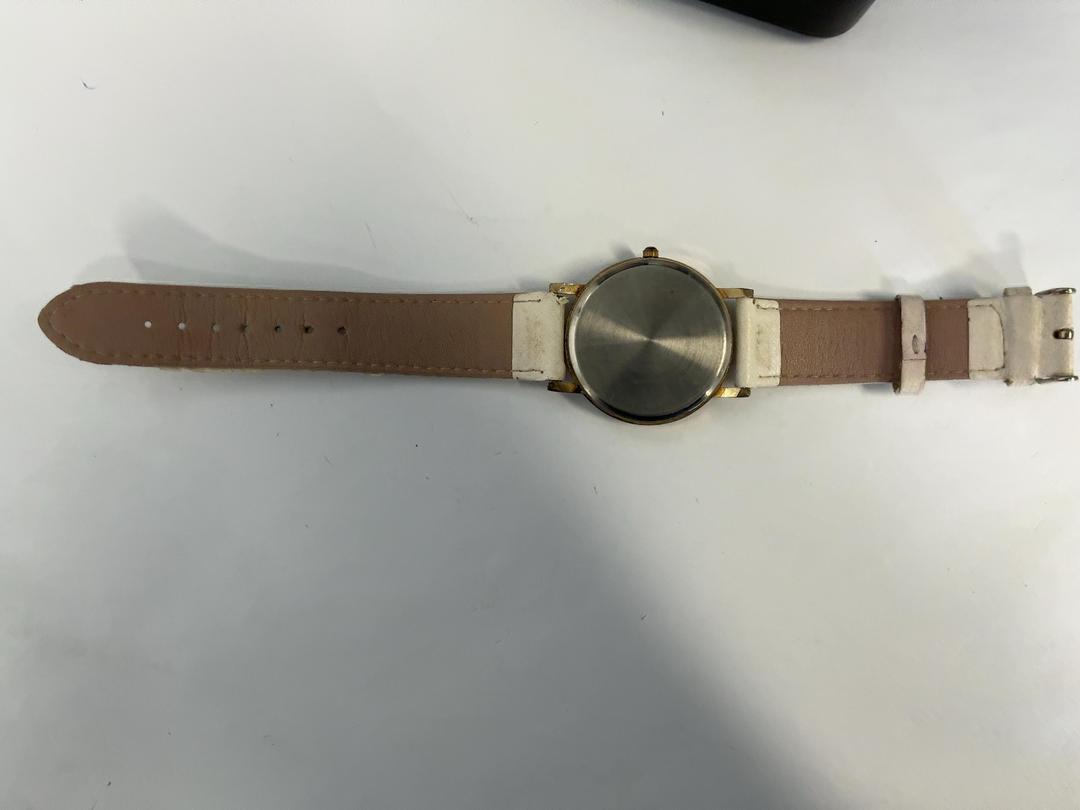 Photo '3' of Gold coloured watch face with cream coloured straps